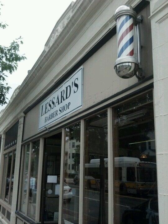 Original Lessard’s storefront sign and traditional barber pole on Washington Street