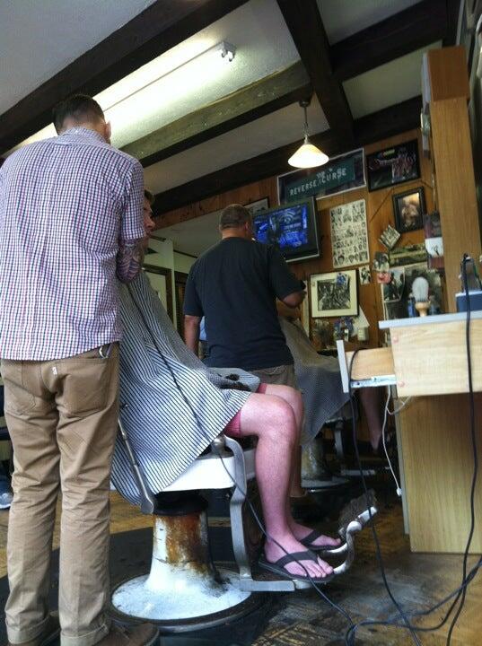 Original photograph of barbering inside Lessard’s Barber Shop